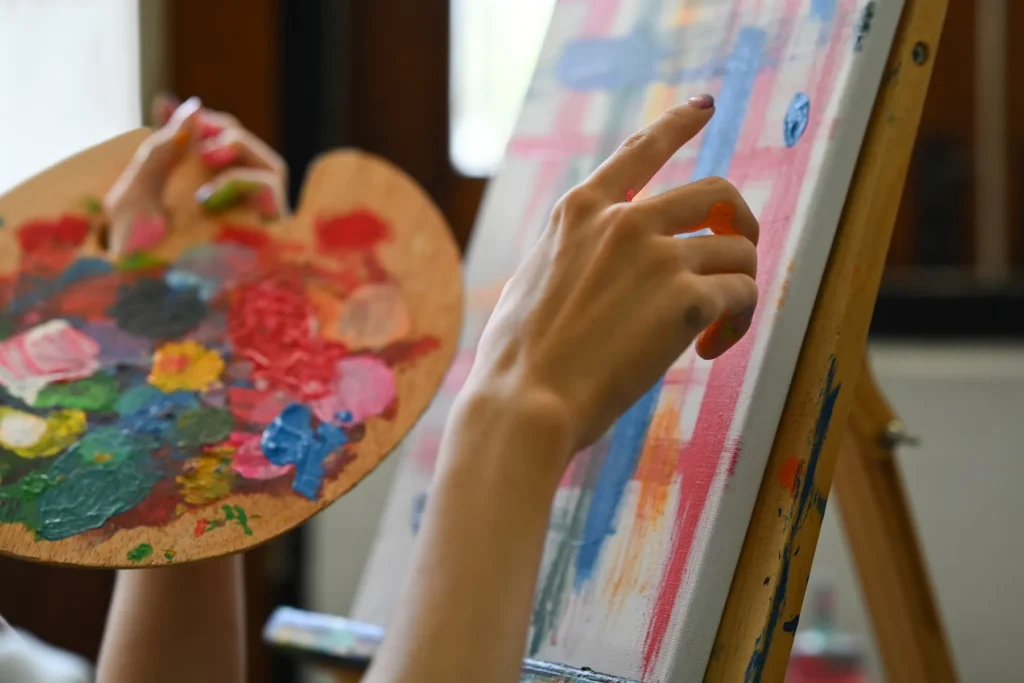 closeup-shot-of-artist-hand-holding-palette-with-m-2026-01-06-09-39-27-utc